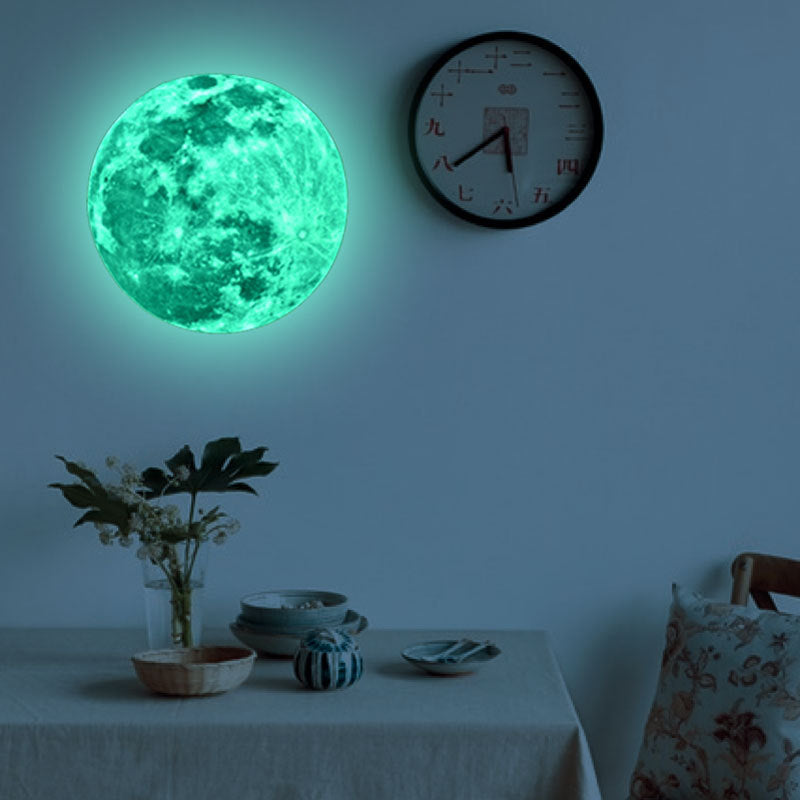 Luminous Wall Stickers Recycling Lunar Environmental Wall Stickers glowing moon decal on blue wall in kids' nautical-themed bedroom. Eco-friendly PVC design.