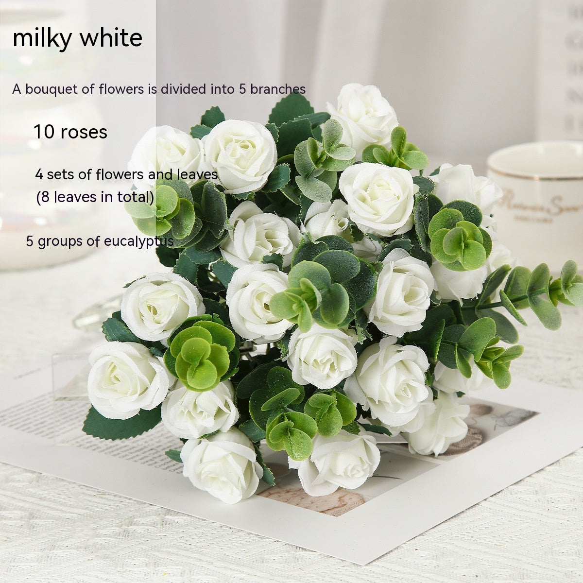 Red silk rose bouquet with green eucalyptus in crystal vase for living room decoration or wedding ceremony artificial flower arrangement.