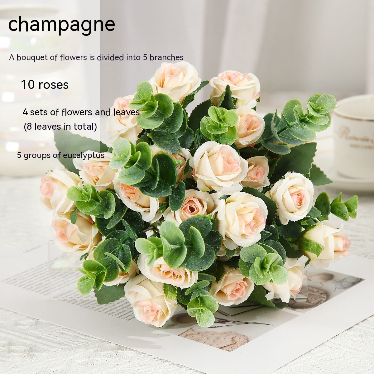 Red silk rose bouquet with green eucalyptus in crystal vase for living room decoration or wedding ceremony artificial flower arrangement.