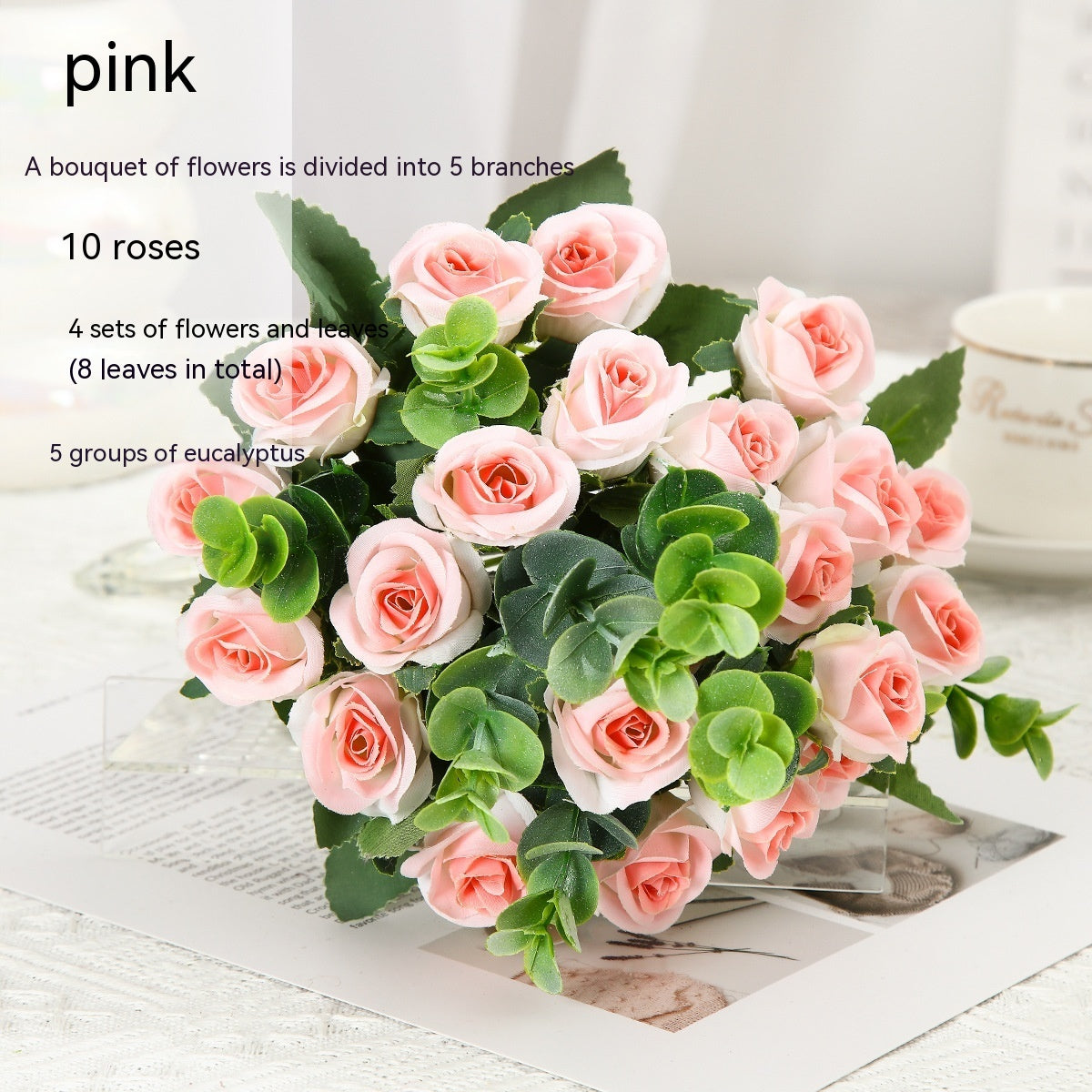Red silk rose bouquet with green eucalyptus in crystal vase for living room decoration or wedding ceremony artificial flower arrangement.