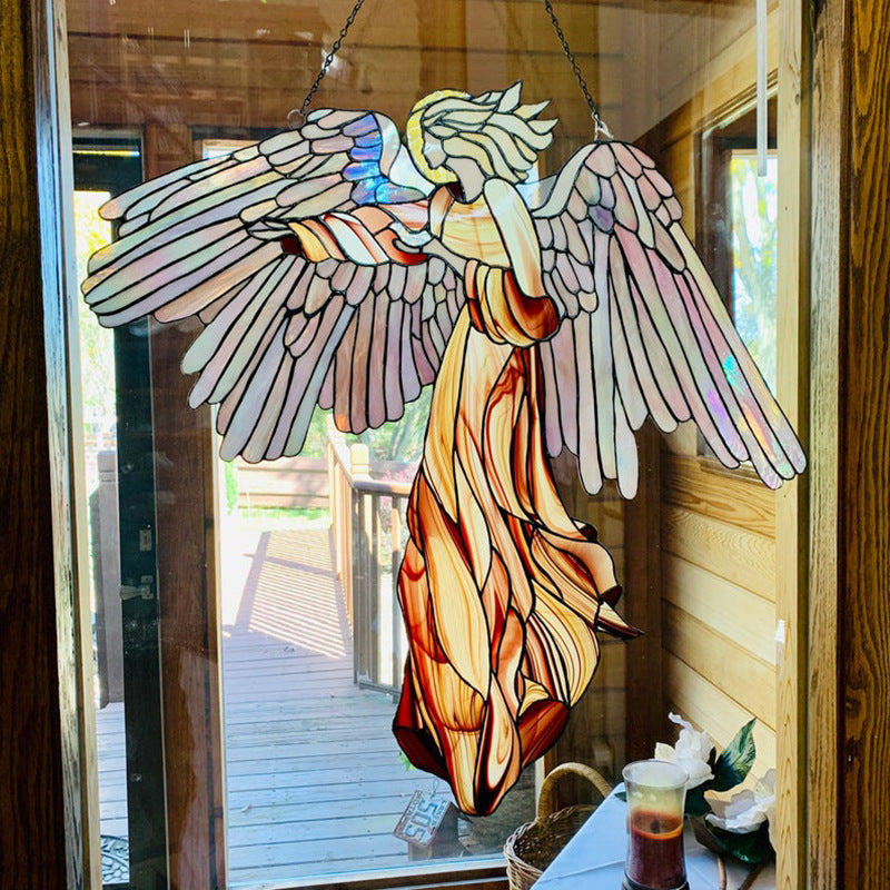 Acrylic angel-shaped suncatcher pendant hanging in a home garden window, ideal for craft decoration and scene enhancement.