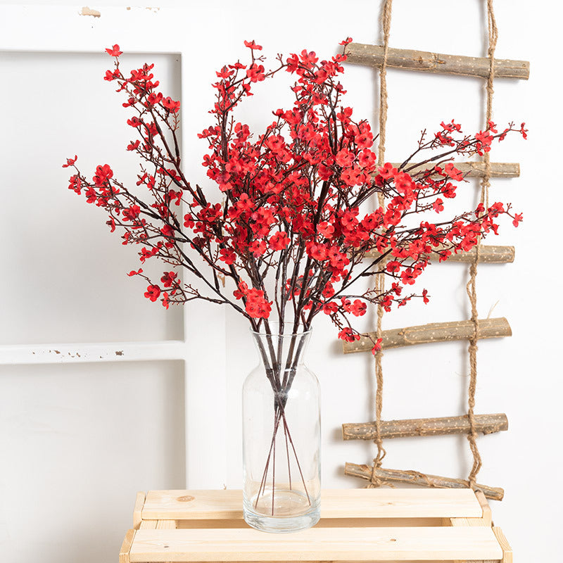 Artificial Gypsophila Flower - Decor | Elegant Arts in vibrant red arranged in a clear glass vase, ideal for home or event decoration.