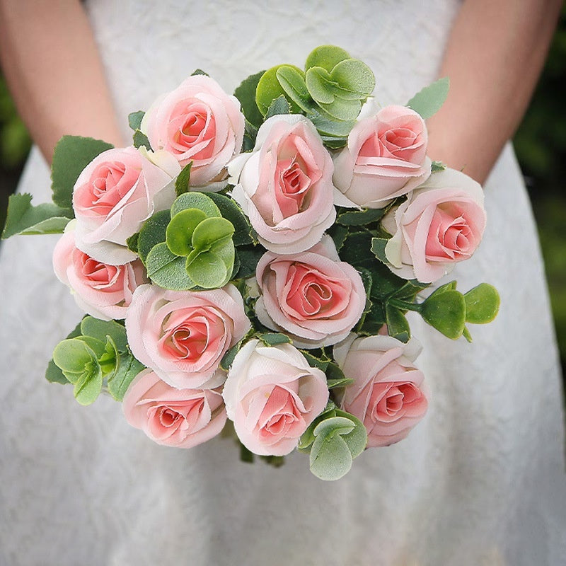 Red silk rose bouquet with green eucalyptus in crystal vase for living room decoration or wedding ceremony artificial flower arrangement.