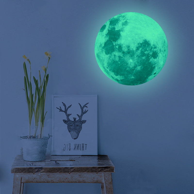 Luminous Wall Stickers Recycling Lunar Environmental Wall Stickers glowing moon decal on blue wall in kids' nautical-themed bedroom. Eco-friendly PVC design.
