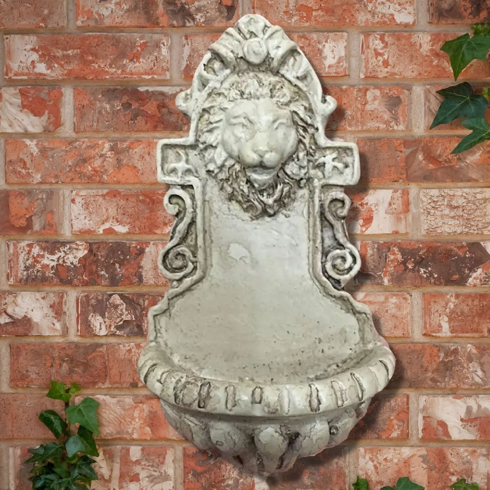 Vintage-style wall-mounted lion head fountain for garden or patio decor, featuring ornate detailing and weathered stone finish.